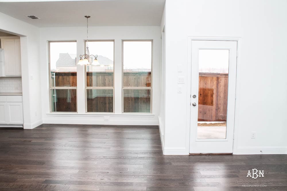 See how I transformed this builder grade breakfast room into a gorgeous coastal look with a full source list! #ABlissfulNest 