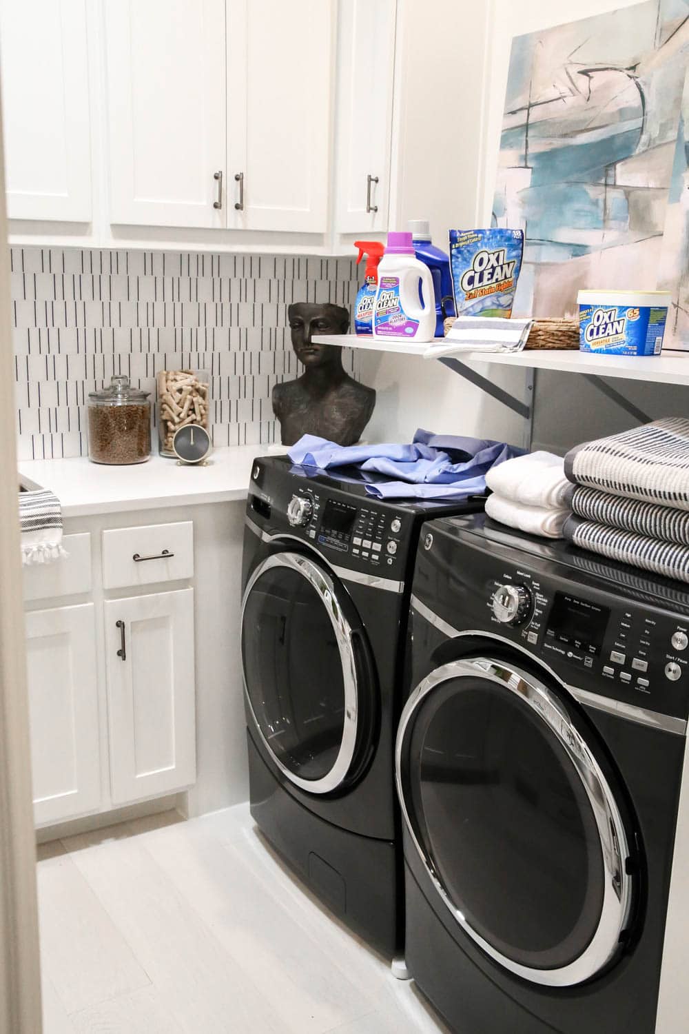 Everyone needs these OxiClean products in their cleaning and Laundry room cabinets to take care of your home. #ad #OxiClean #OxiCleanWOW #SmartSolutions