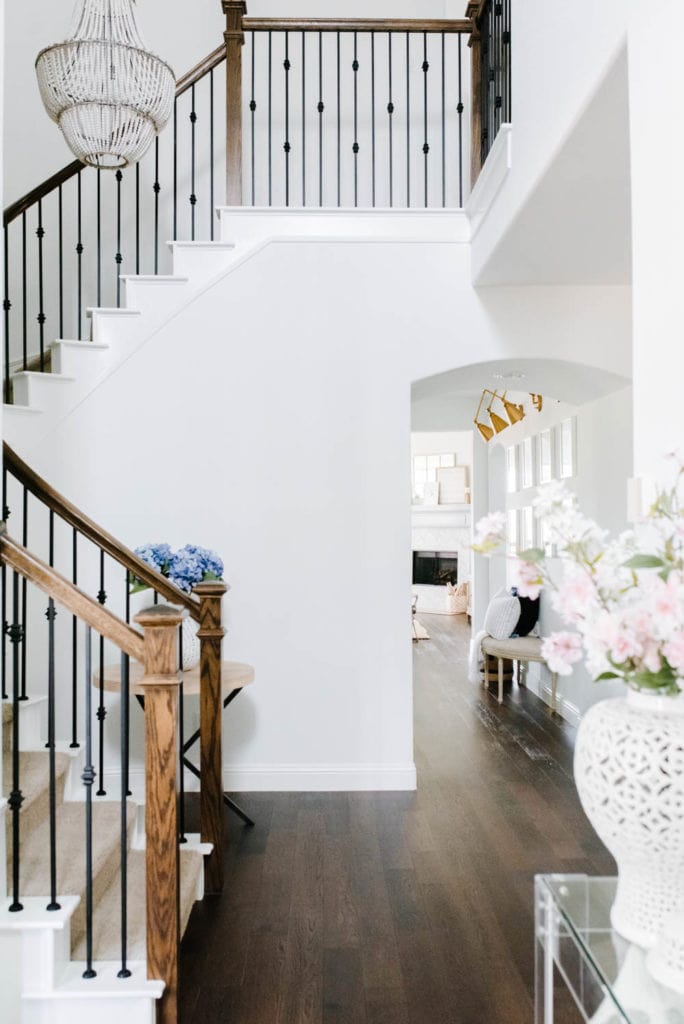 Entryway with stairwell and blue and white decor