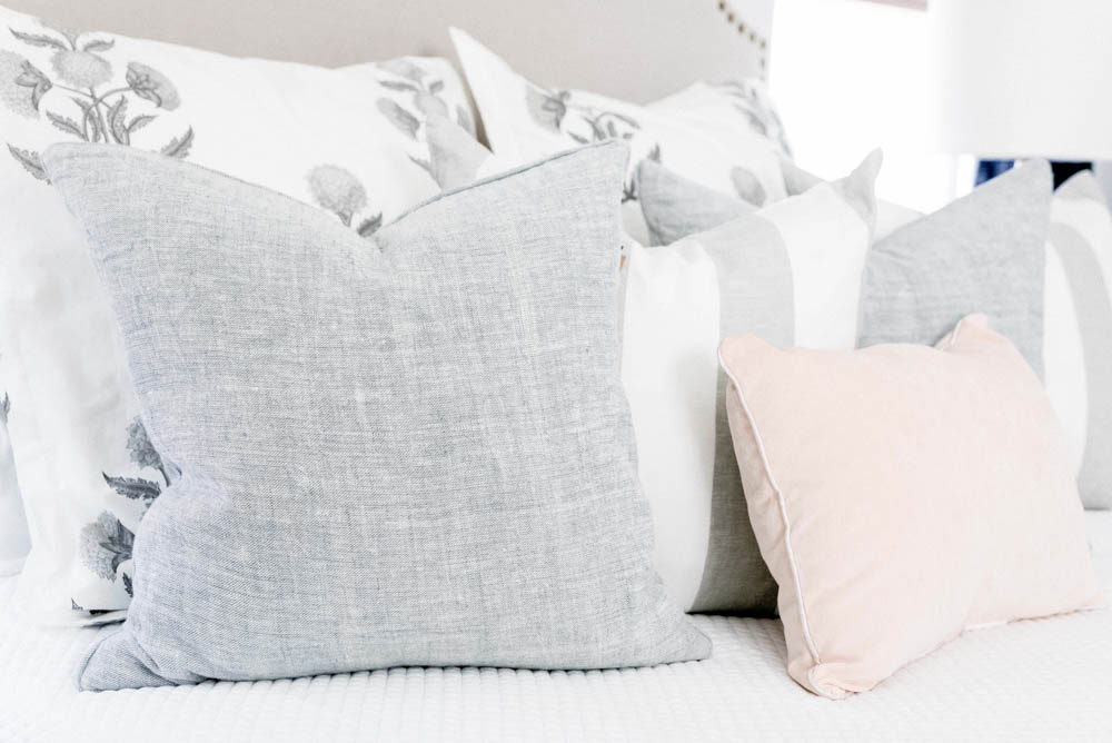 Blue and blush bedroom with navy accents. Summer decorating ideas for a bedroom or a guest bedroom. #ABlissfulNest #summer #guestbedroom #bedroomideas