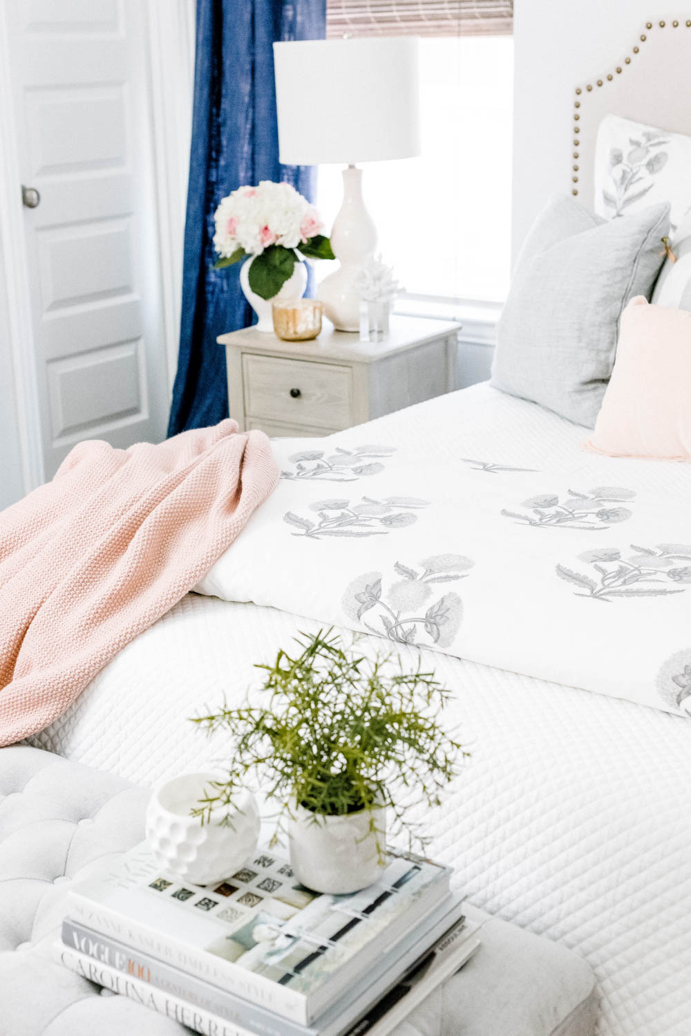 Blue and blush bedroom with navy accents. Summer decorating ideas for a bedroom or a guest bedroom. #ABlissfulNest #summer #guestbedroom #bedroomideas