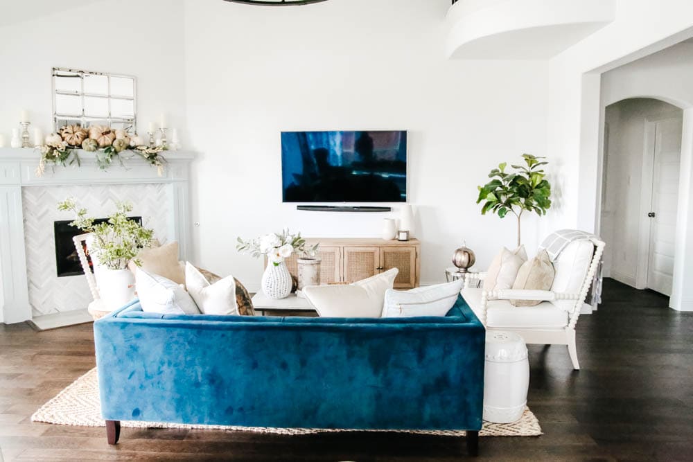 Navy sofa and neutral fall decor. Simple fall decorating tips to get this modern coastal look. #ABlissfulNest #falldecor #livingroomideas #fallinspiration