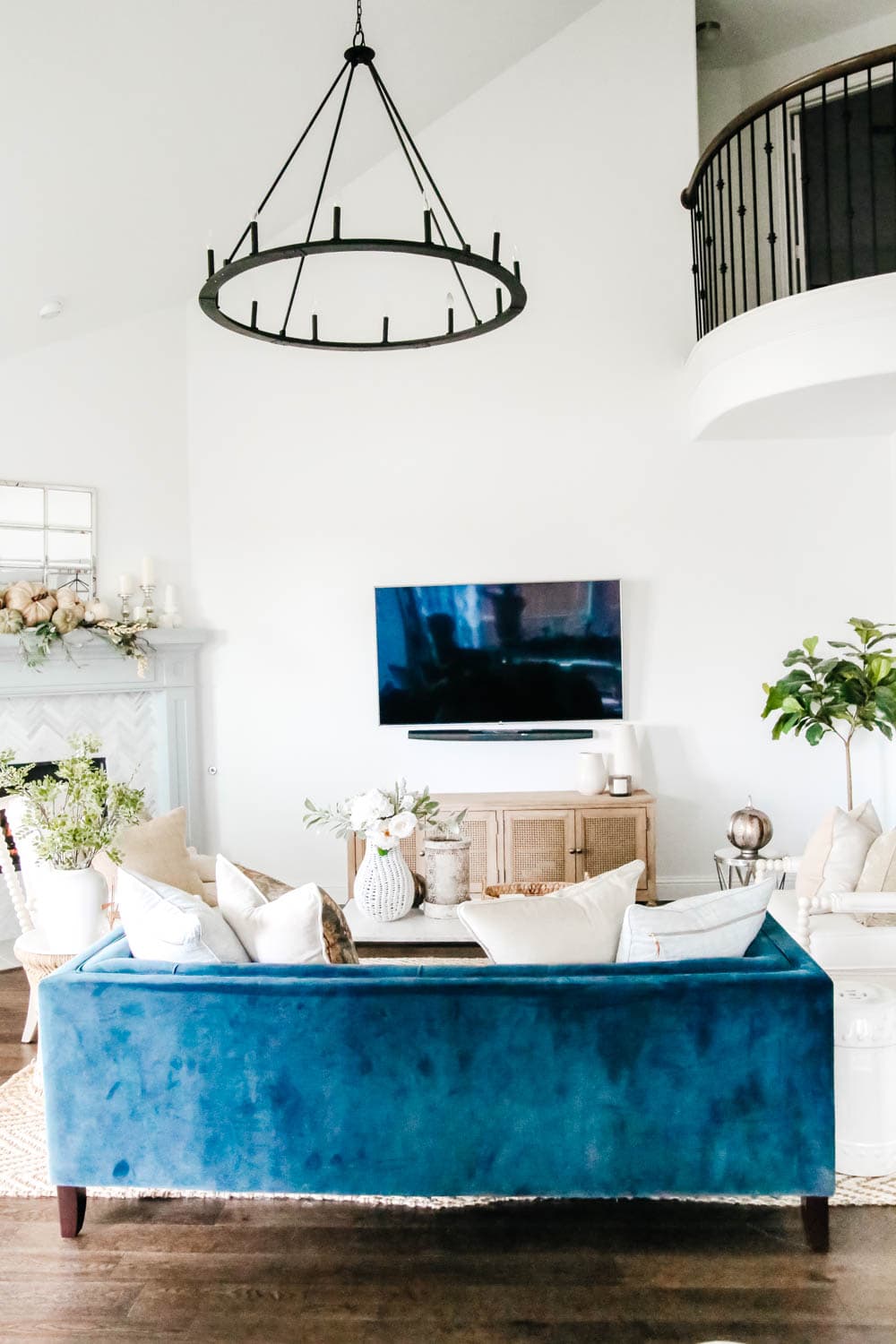 Navy sofa, tv wall, neutral decor, open concept living room. #ABlissfulNest #livingroomideas #openconcept