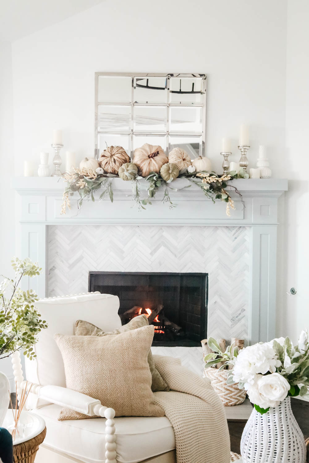 Coastal fireplace mantle decorated for fall. Natural pumpkins, neutral fall decor ideas for the living room. #ABlissfulNest #falldecor #falldecoratingideas #livingroomideas #fireplacemantle