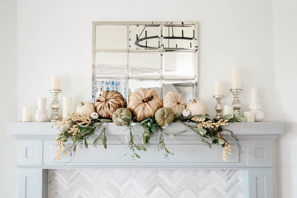 Fireplace mantle decorated for fall. Natural pumpkins, neutral fall decor ideas for the living room. #ABlissfulNest #falldecor #falldecoratingideas #livingroomideas #fireplacemantle