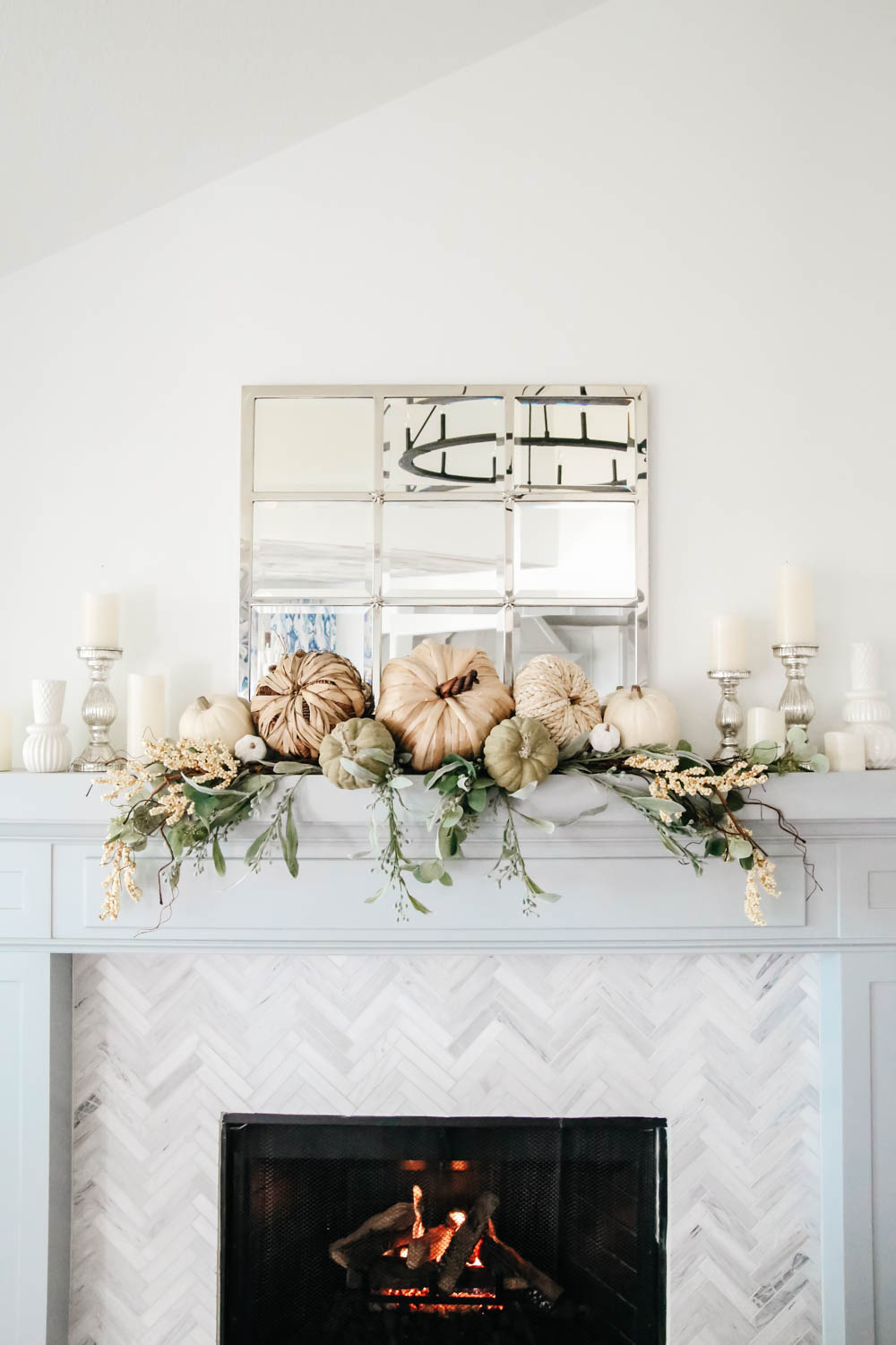 Fireplace mantle decorated for fall. Natural pumpkins, neutral fall decor ideas for the living room. #ABlissfulNest #falldecor #falldecoratingideas #livingroomideas #fireplacemantle