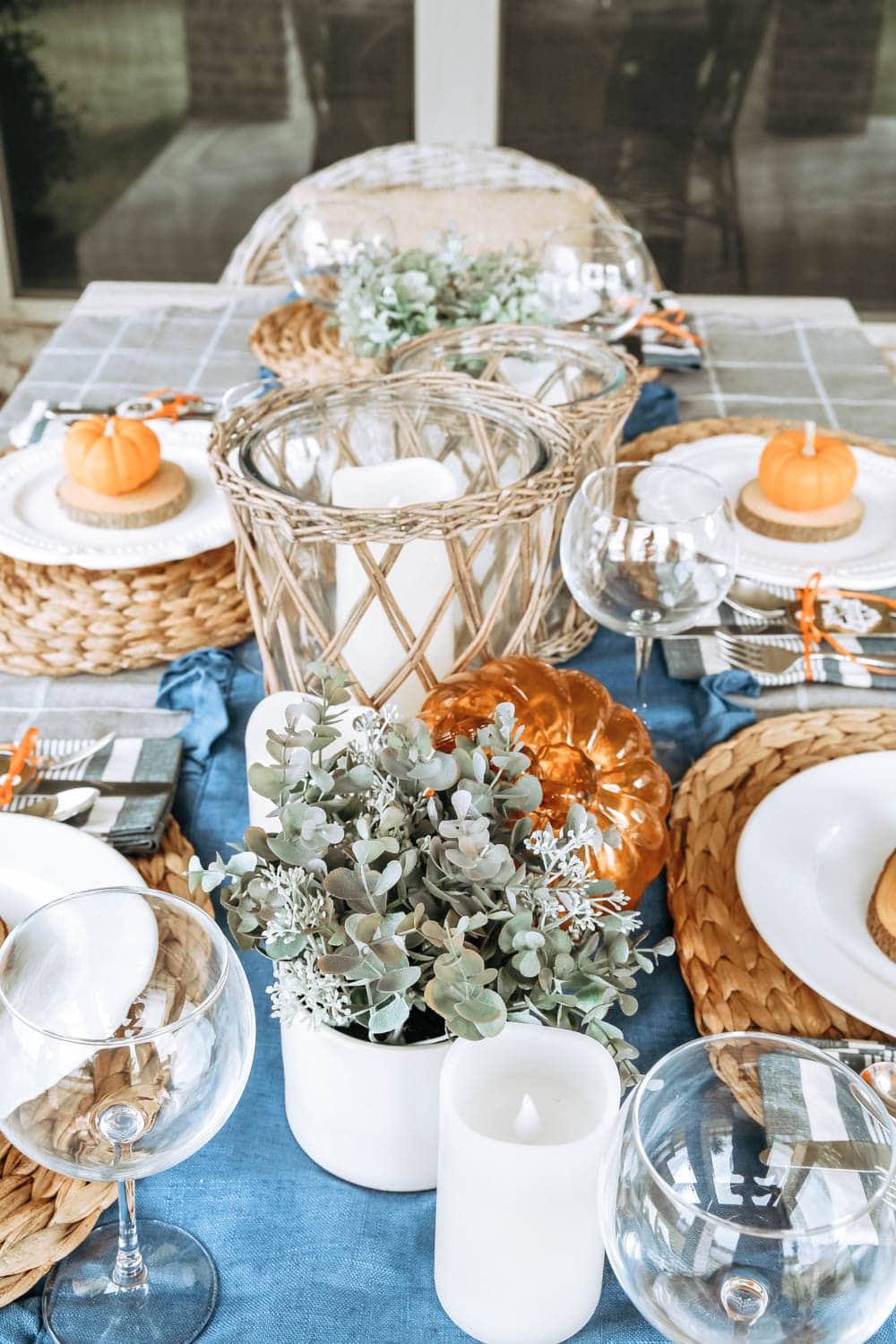 Add lots of candles to an outside fall table for ambience. #ABlissfulNest #fall #falldecor