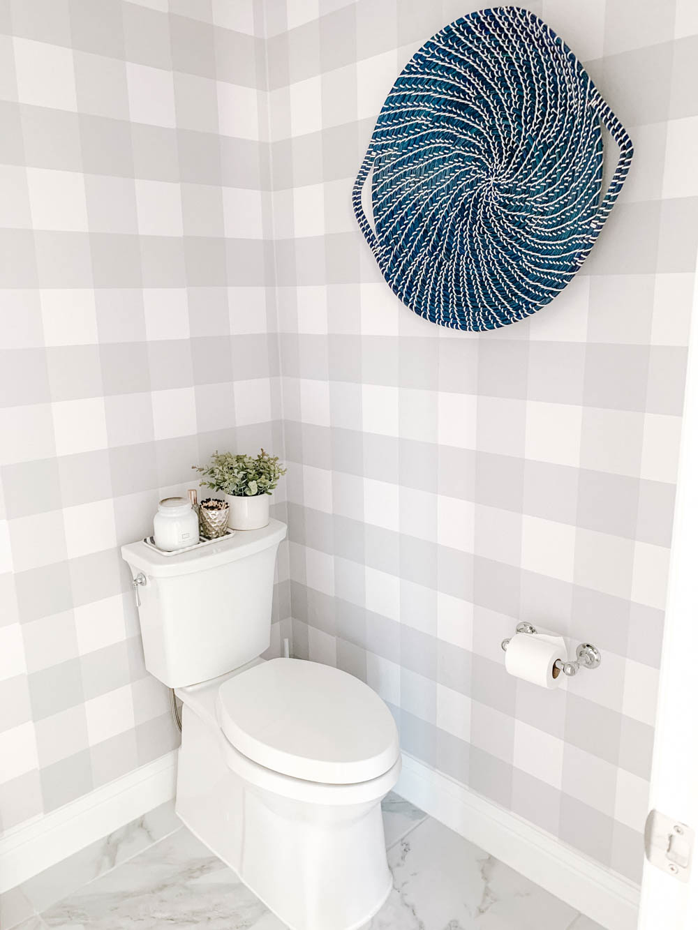 Blue and white basket for wall decor mixed with grey and white buffalo check wallpaper. #ABlissfulNest #bathroom #bathroomdesign #farmhousedecor
