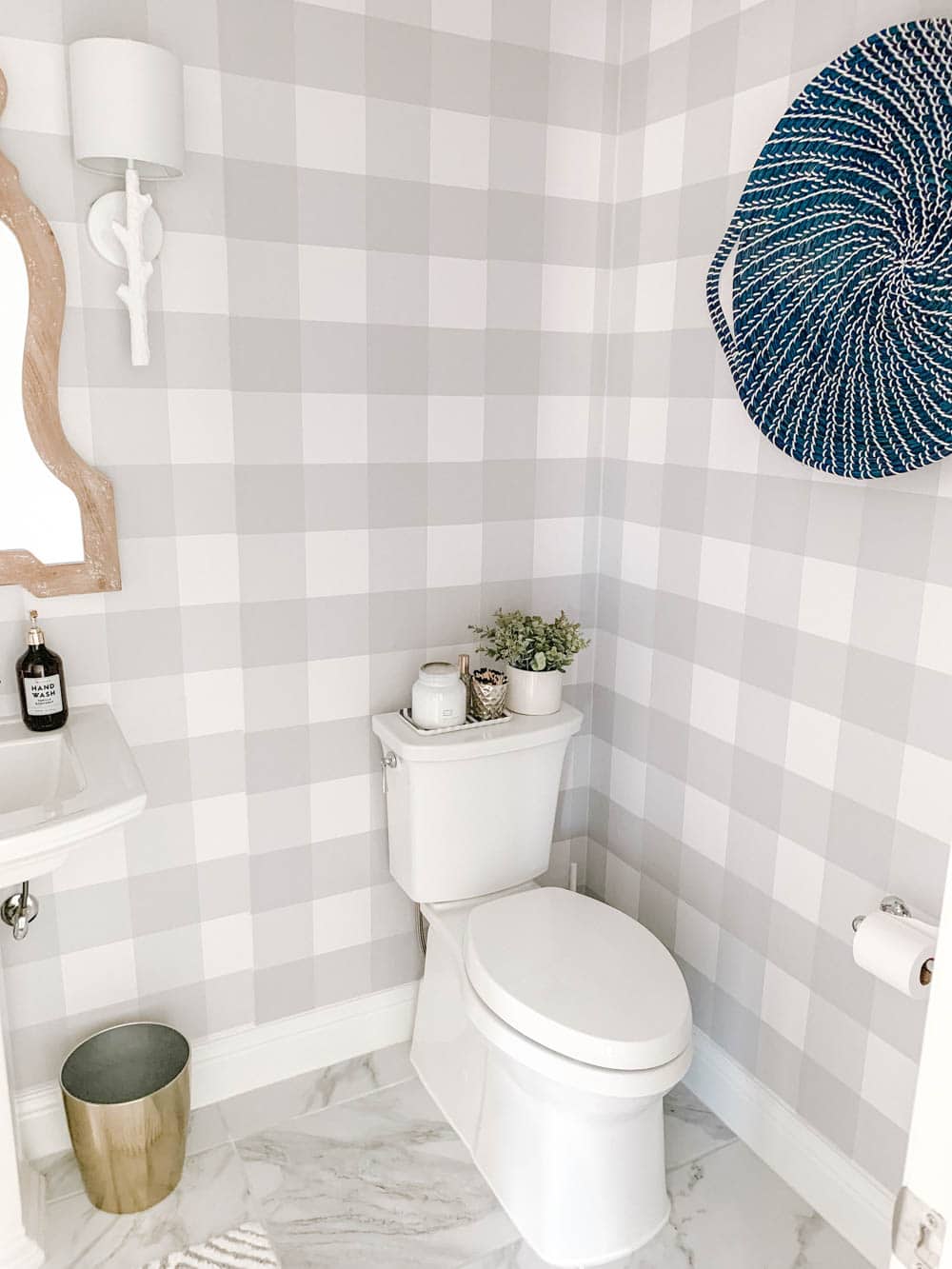 Clean white accents and grey and white buffalo check wallpaper. #ABlissfulNest #bathroomdesign #bathroom