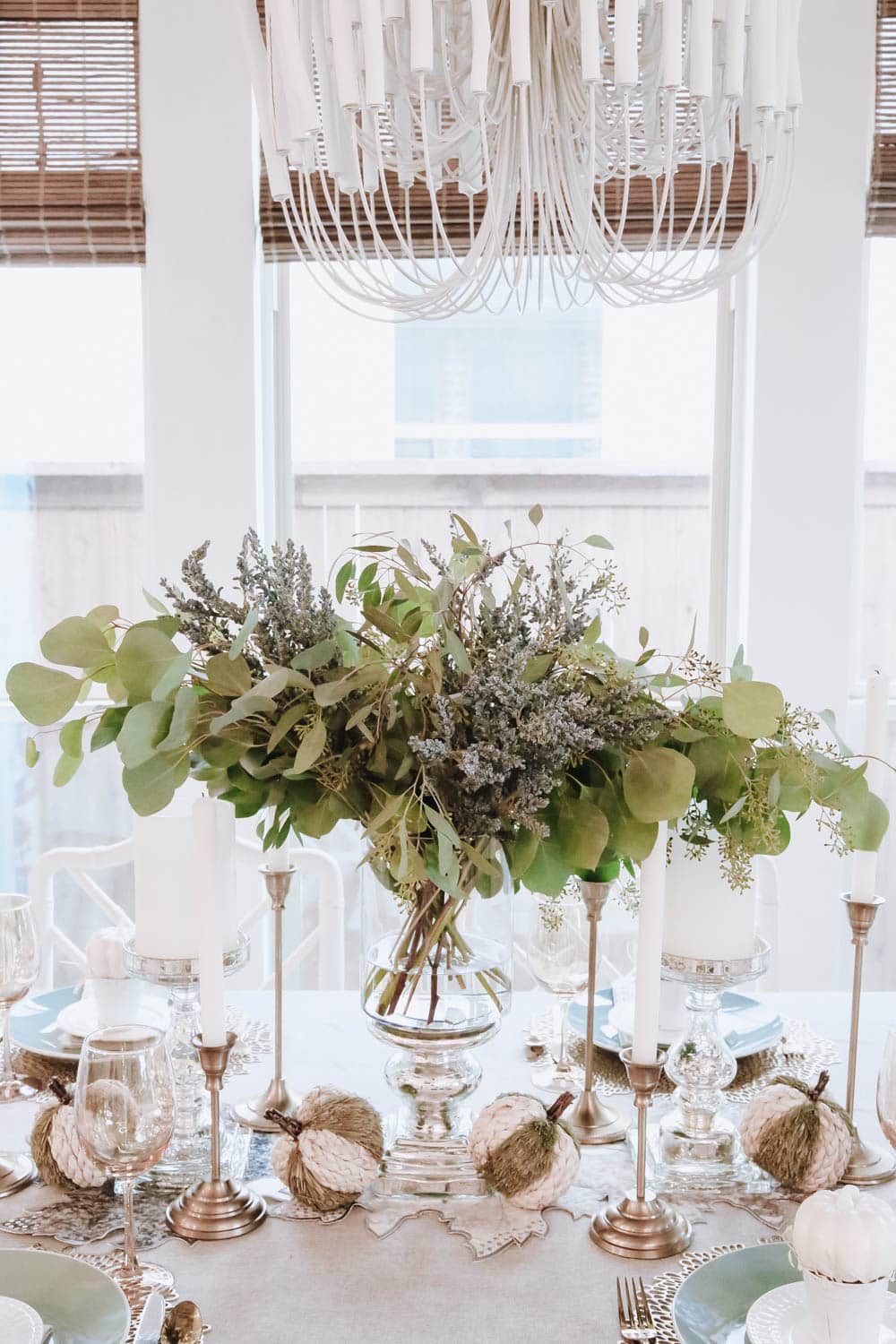 Simple seeded eucalyptus branches in a silver hurricane is beautiful and elegant for this fall table. #ABlissfulNest #thanksgiving #falldecor 