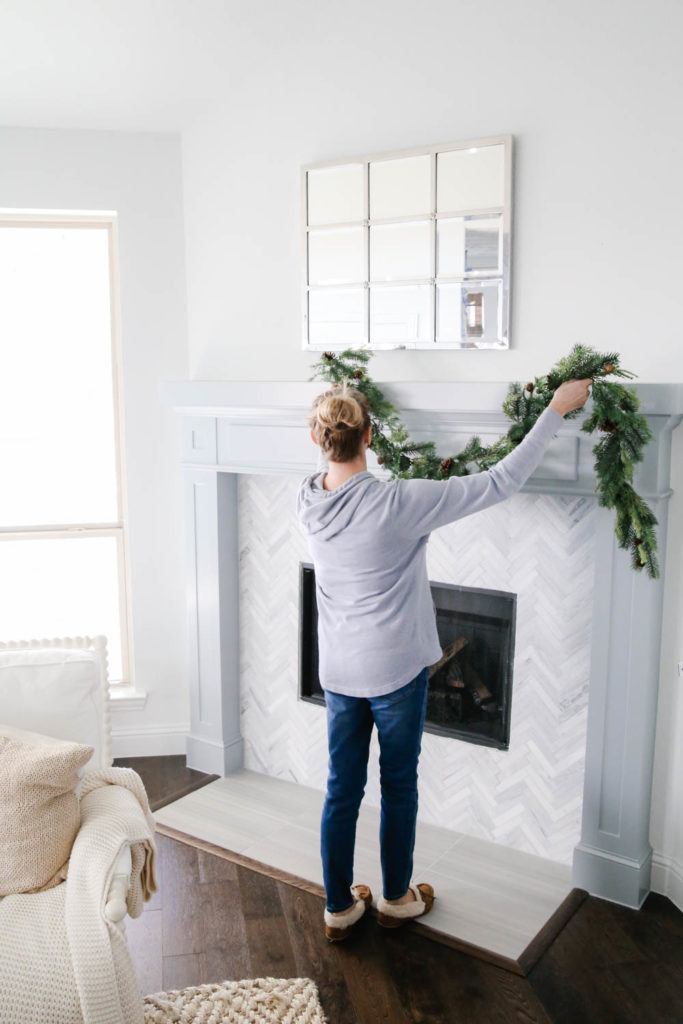How To Hang Holiday Garland Without Damaging Your Mantel