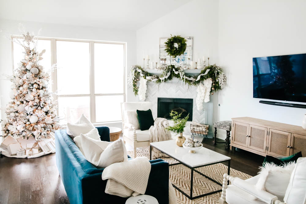 Green accent and soft subtle Christmas decor in a blue and white living room. #ABlissfulNest #christmasdecor #christmashometour