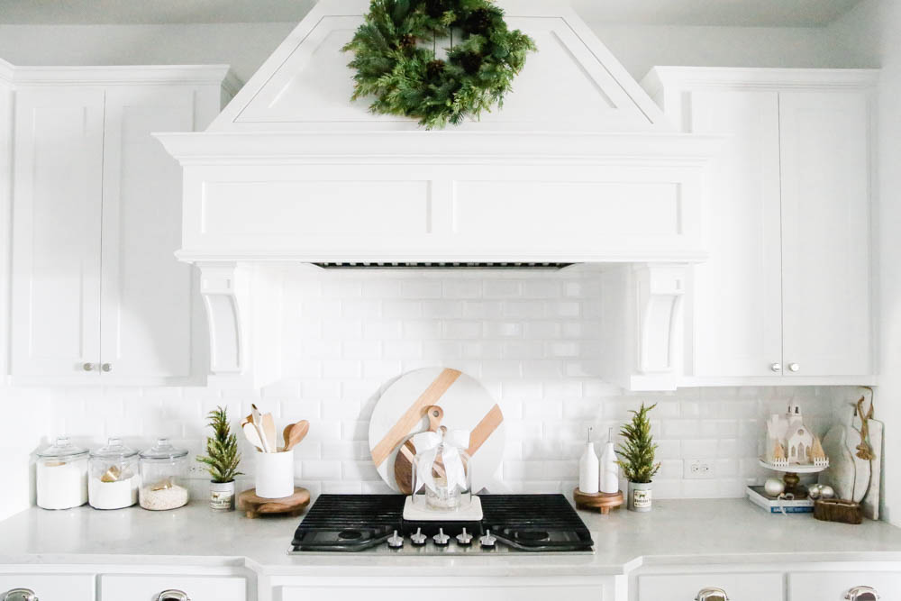 Christmas wreath on kitchen hood, Christmas decorating accents in the kitchen. #ABlissfulNest #whitekitchen #Christmaskitchen