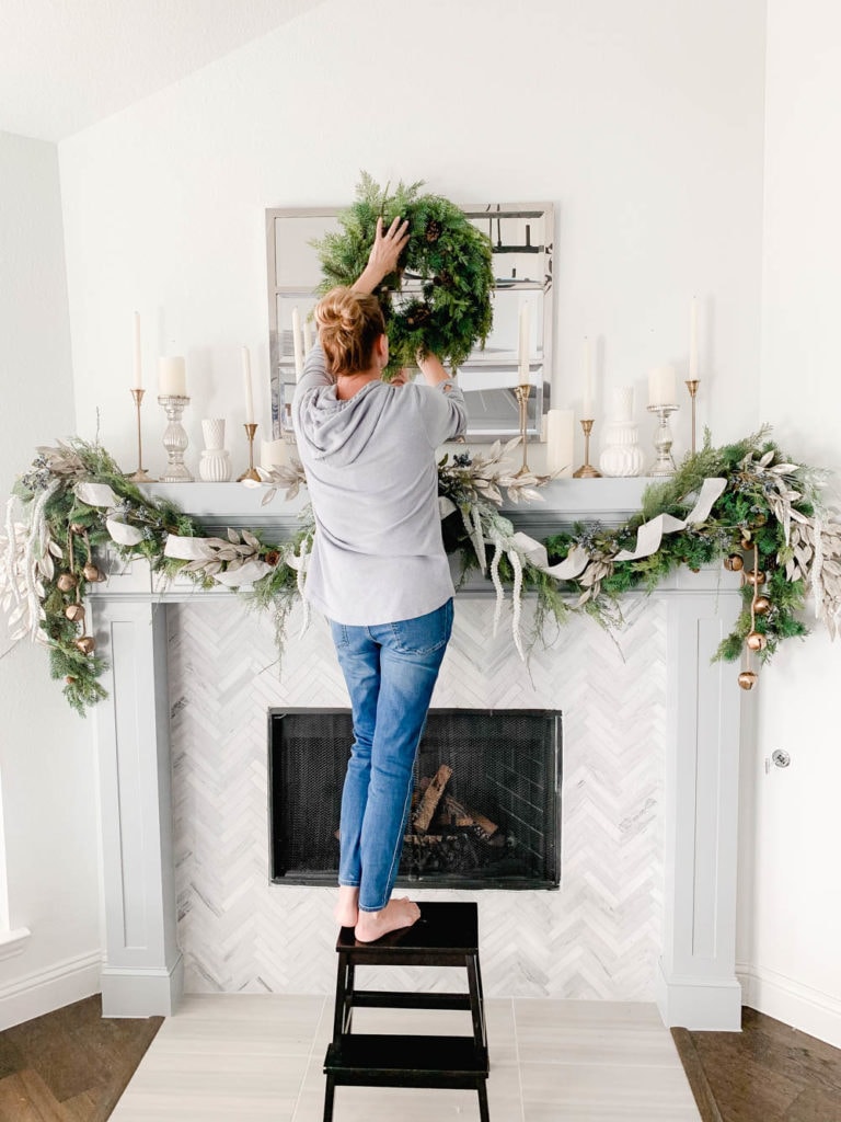 How To Hang Holiday Garland Without Damaging Your Mantel