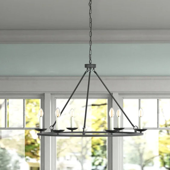 This black wagon wheel chandelier has such a fun modern farmhouse feel to it! #ABlissfulNest