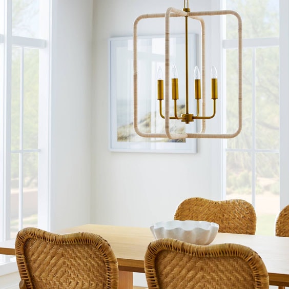 This rattan and brass pendant light is perfect for over your dining table! #ABlissfulNest