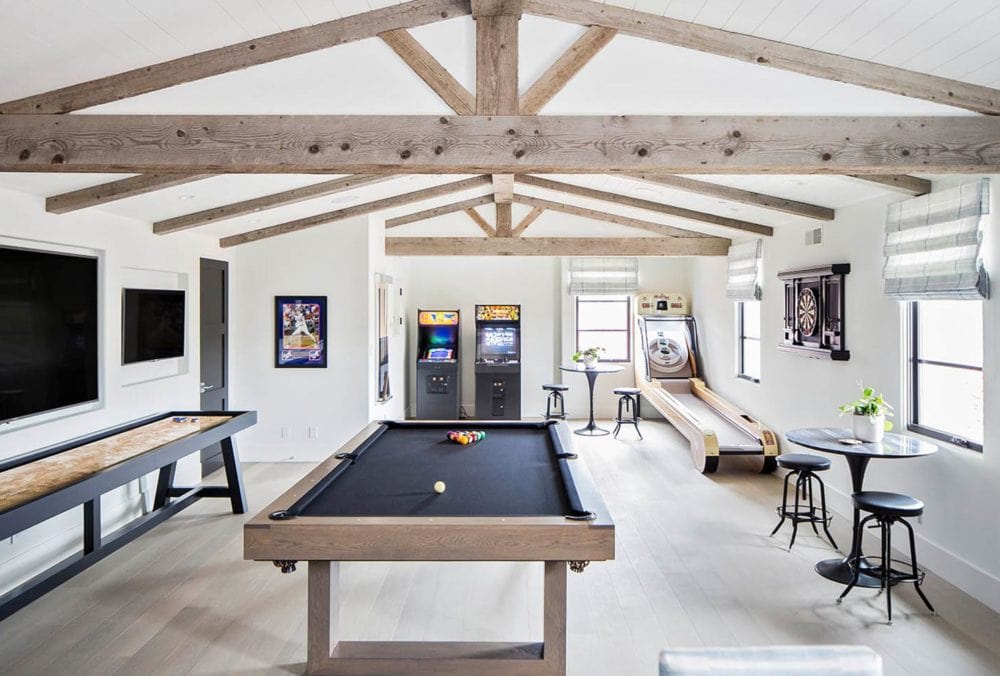 Love the beams in this bonus room and the farmhouse look. #gameroom #mediaroom