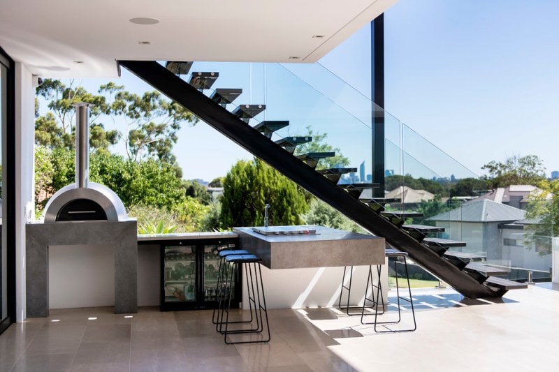 outdoor patio bar built underneath outdoor stairs