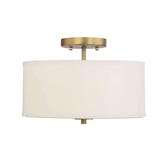 This fabric and brass flush mount light is under $100! #ABlissfulNest