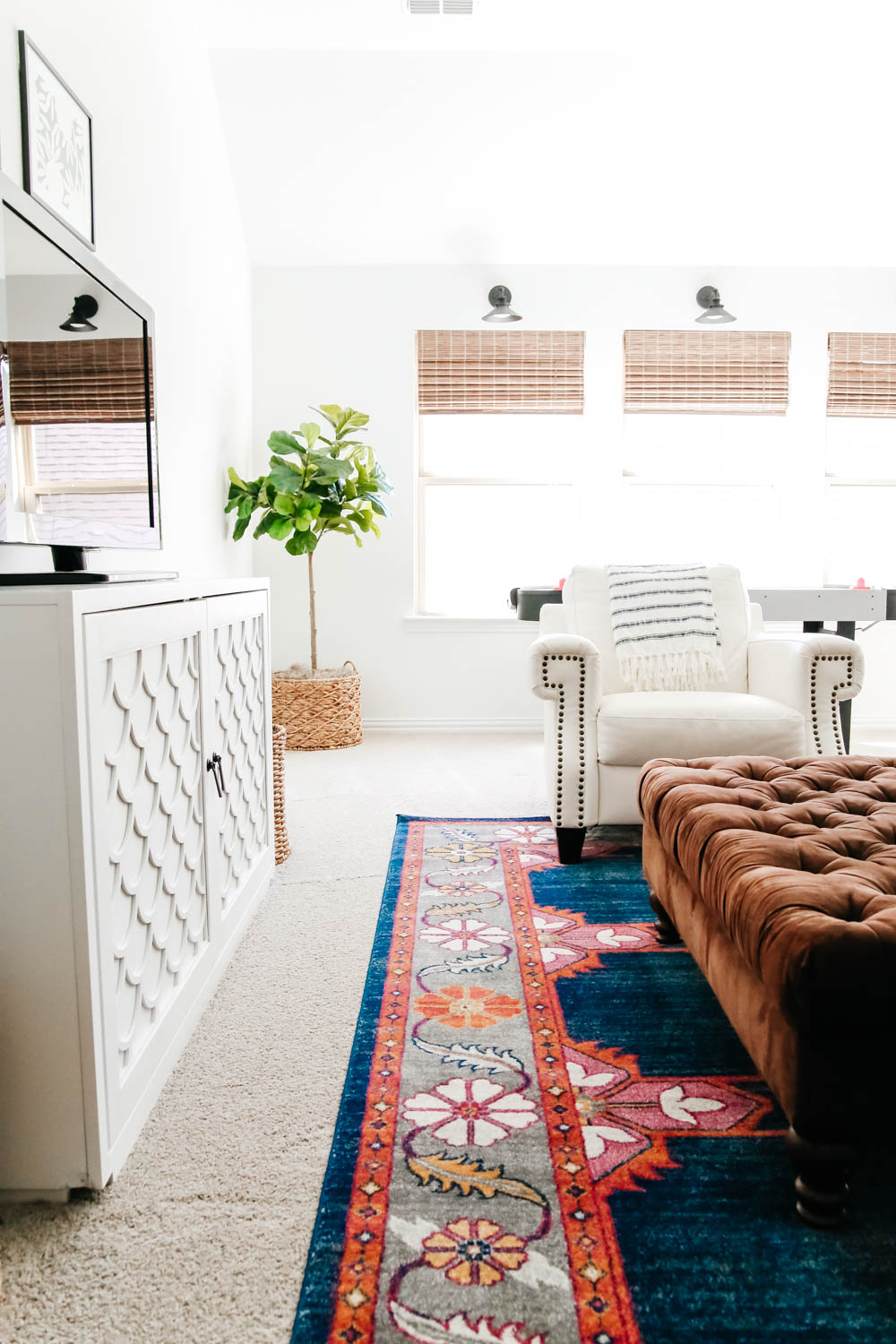 vibrant colors in this rug add lots of color and pattern to this game room. #ABlissfulNest #gameroom #mediaroom