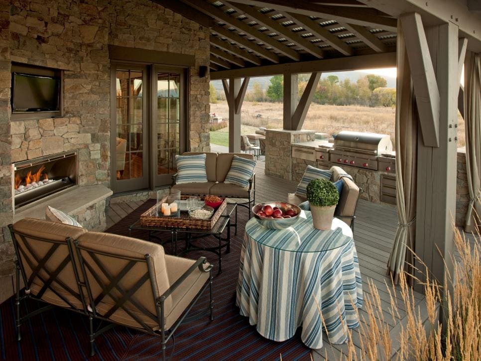 outdoor bar next to a fireplace and couch