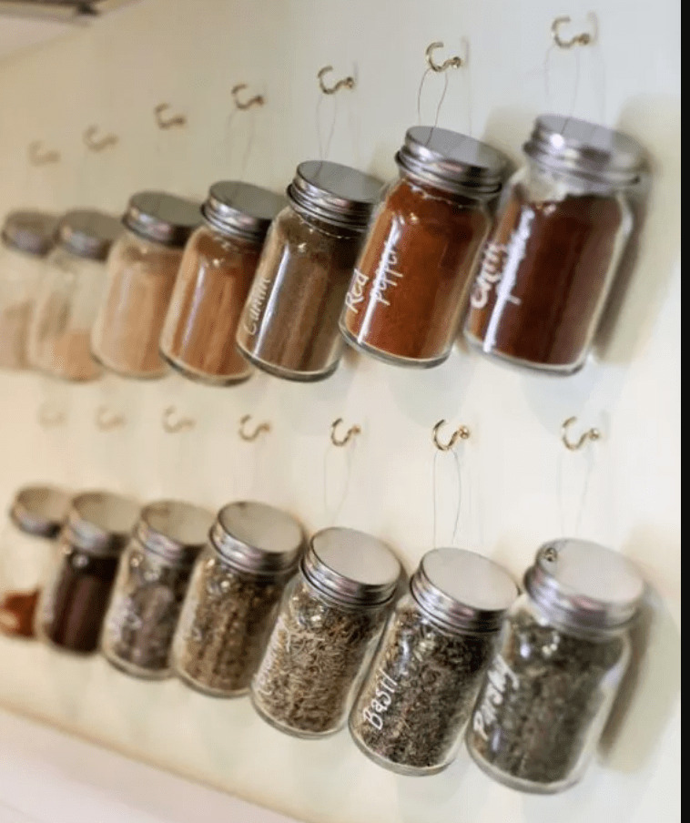 hang spice jars from hooks on the wall