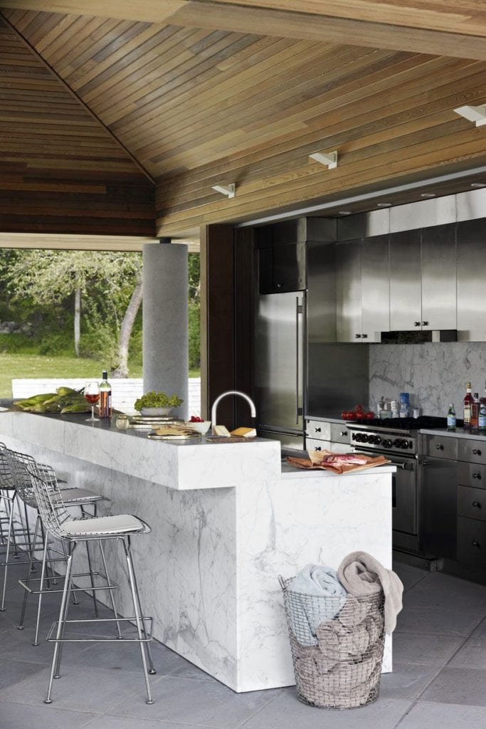 stained oak and marble outdoor kitchen bar