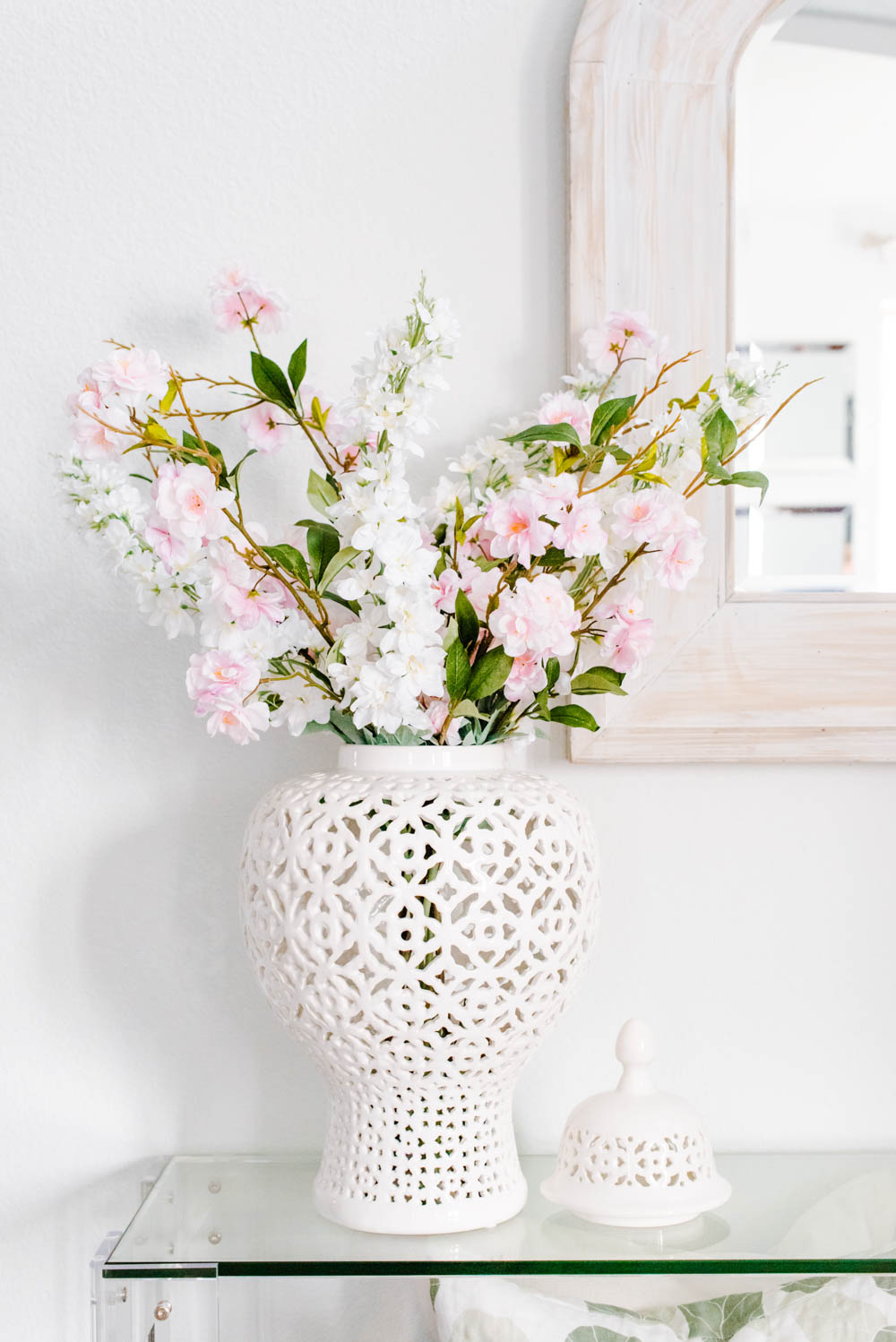 Vases with Beautiful Flowers on Table in Kitchen Interior. Stock