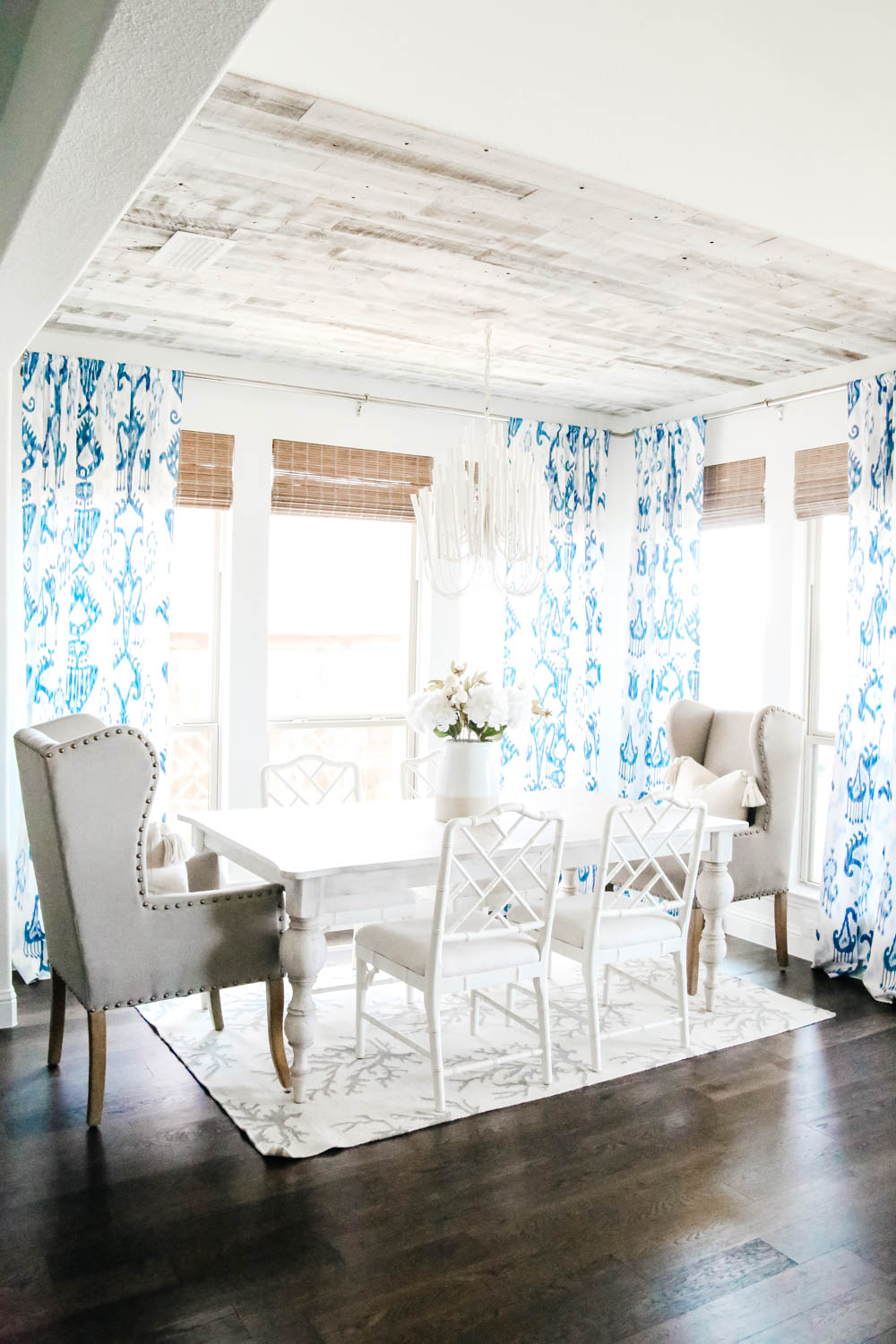 Blue and white dining room with bamboo shades. #diningroom #breakfastroom #ABlissfulNest