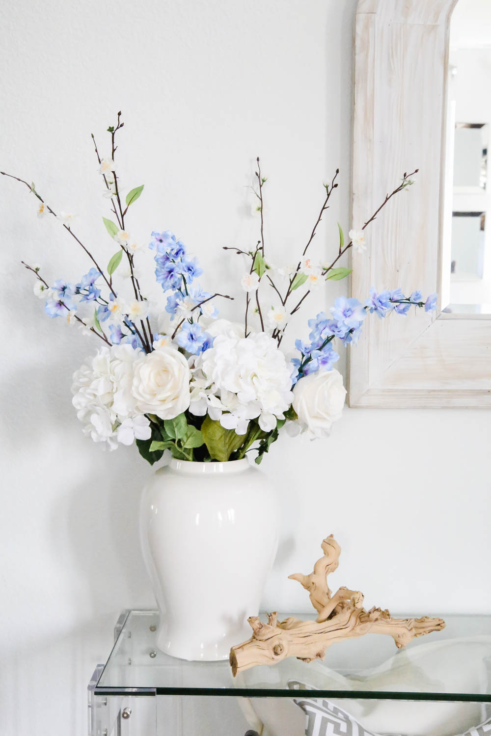 Beautiful spring floral arrangement in white vase, simple branch decor, spring decorating ideas. #ABlissfulNest #springdecor #springideas