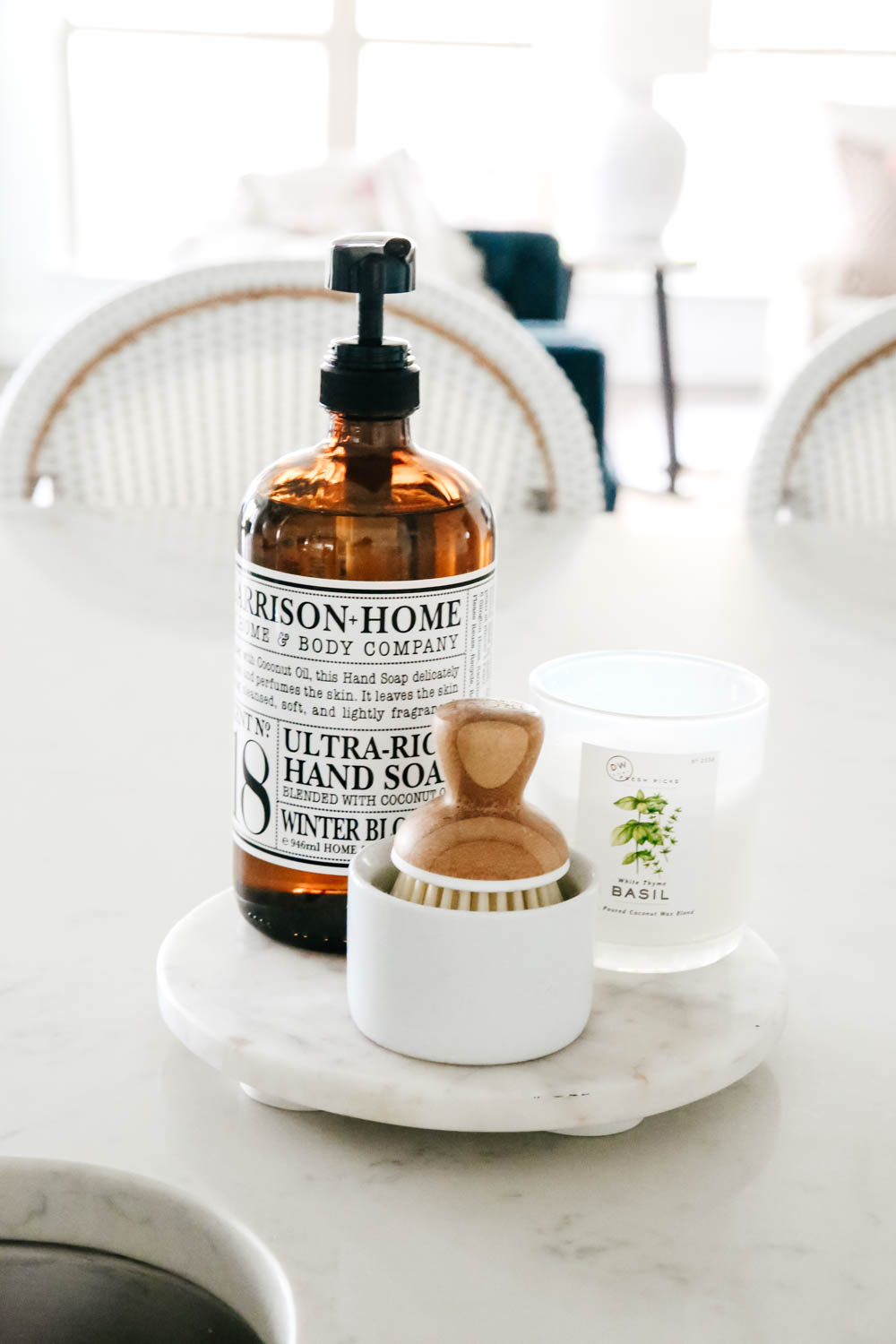 Soap vignette in kitchen. Clustered on a round white marble tray. #ABlissfulNest #homedecor #whitekitchen