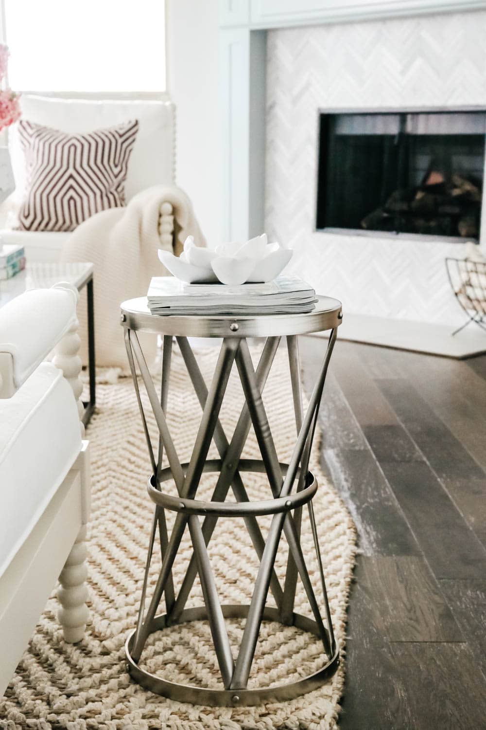 Metal side table with modern flower art. Living room inspiration. #livingroom #livingroominspo #hometour #ABlissfulNest