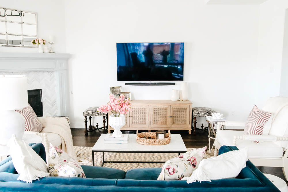 Tv wall with navy blue sofa and white walls. #hometour #designtips #livingroominspo #livingroom #ABlissfulNest