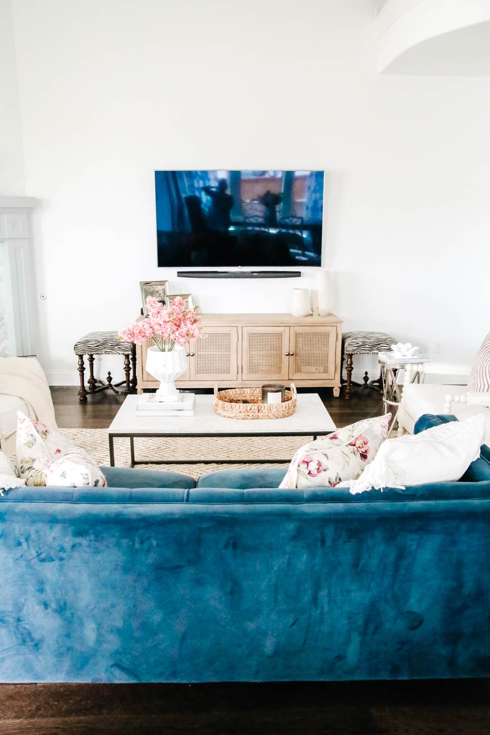 Tv wall with navy blue sofa and white walls. #hometour #designtips #livingroominspo #livingroom #ABlissfulNest