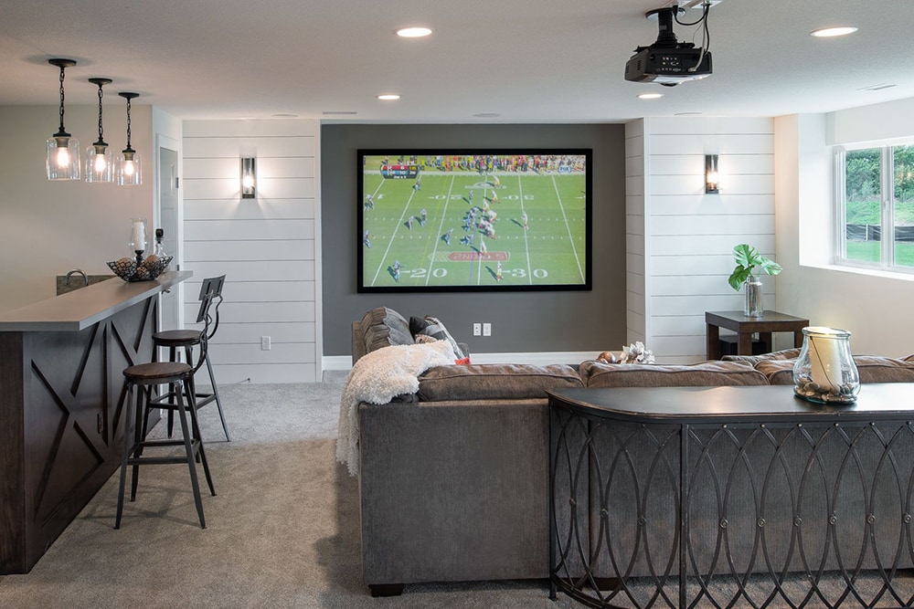 Create a feature wall and multiple seating areas for your home media room. #mediaroom #theaterroom