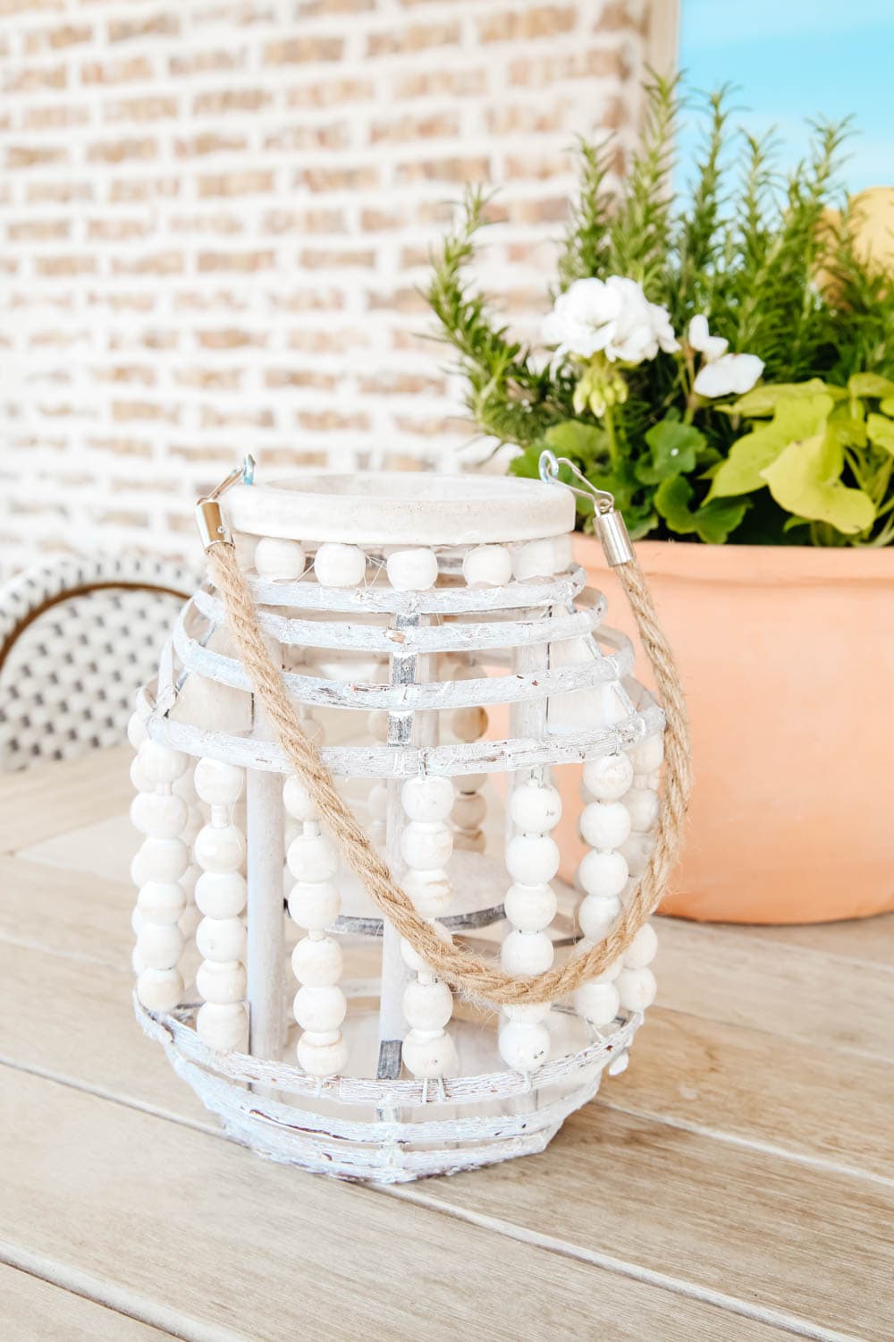 Add lanterns to a patio for ambience and to refresh your space. #ABlissfulNest #outdoordecor #patio #summerdecor