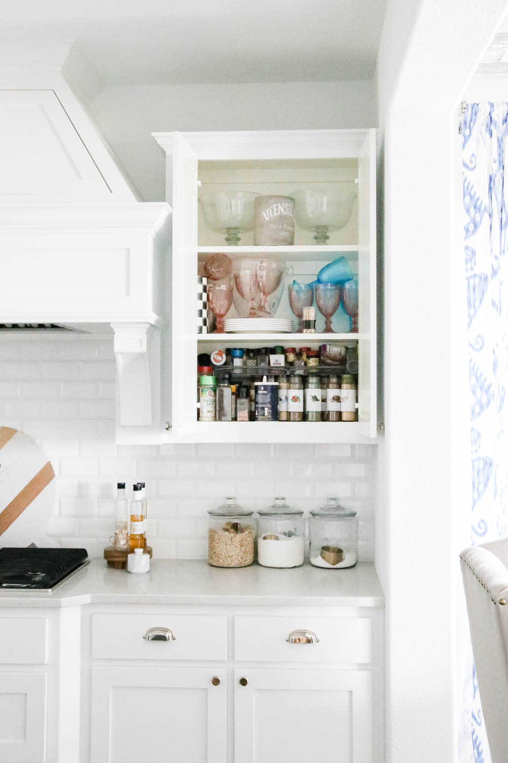 A before and after on how to purge a spice cabinet and the best organization products to use. #spicecabinet #kitchen #organization #ABlissfulNest