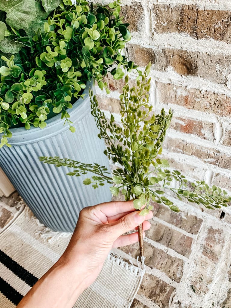 How To Fill An Outdoor Planter With Artificial Flowers