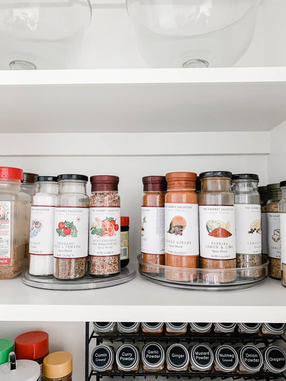 A before and after on how to purge a spice cabinet and the best organization products to use. #spicecabinet #kitchen #organization #ABlissfulNest