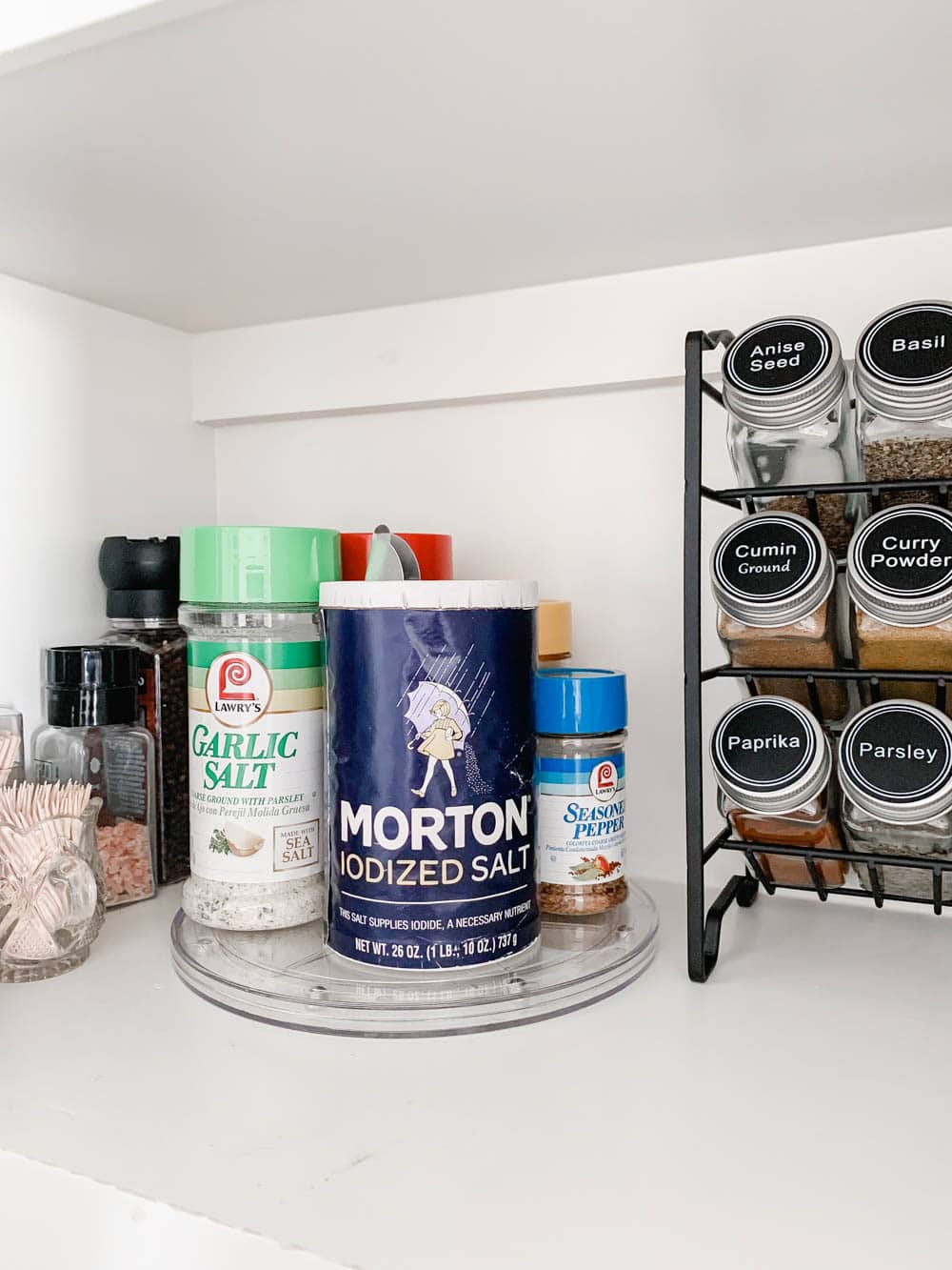 A before and after on how to purge a spice cabinet and the best organization products to use. #spicecabinet #kitchen #organization #ABlissfulNest