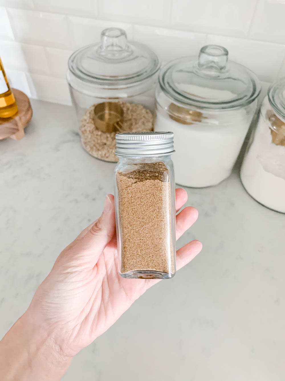 A before and after on how to purge a spice cabinet and the best organization products to use. #spicecabinet #kitchen #organization #ABlissfulNest
