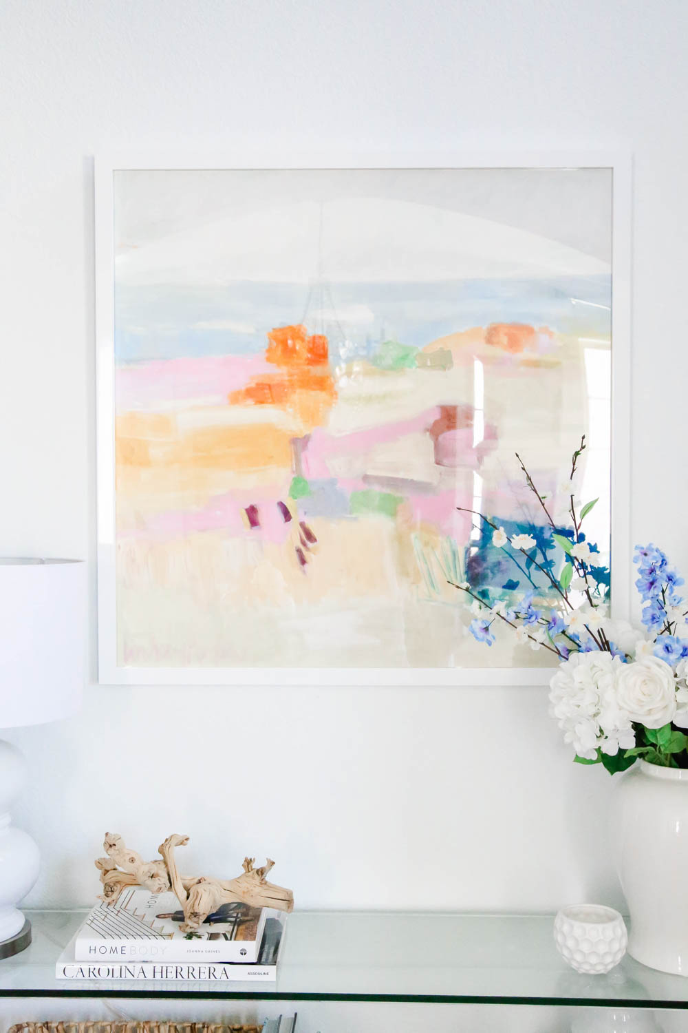 A colorful piece of art transforms this entryway for summer. #summerdecor #entryway #ABlissfulNest