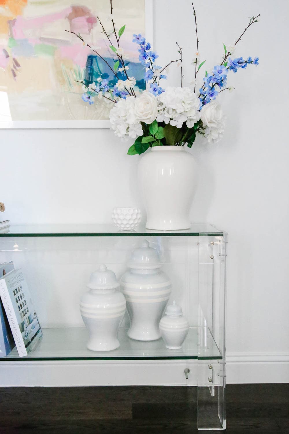 Ginger jars, faux florals, modern art, lucite table, entryway decor. #entryway #summerdecor #ABlissfulNest