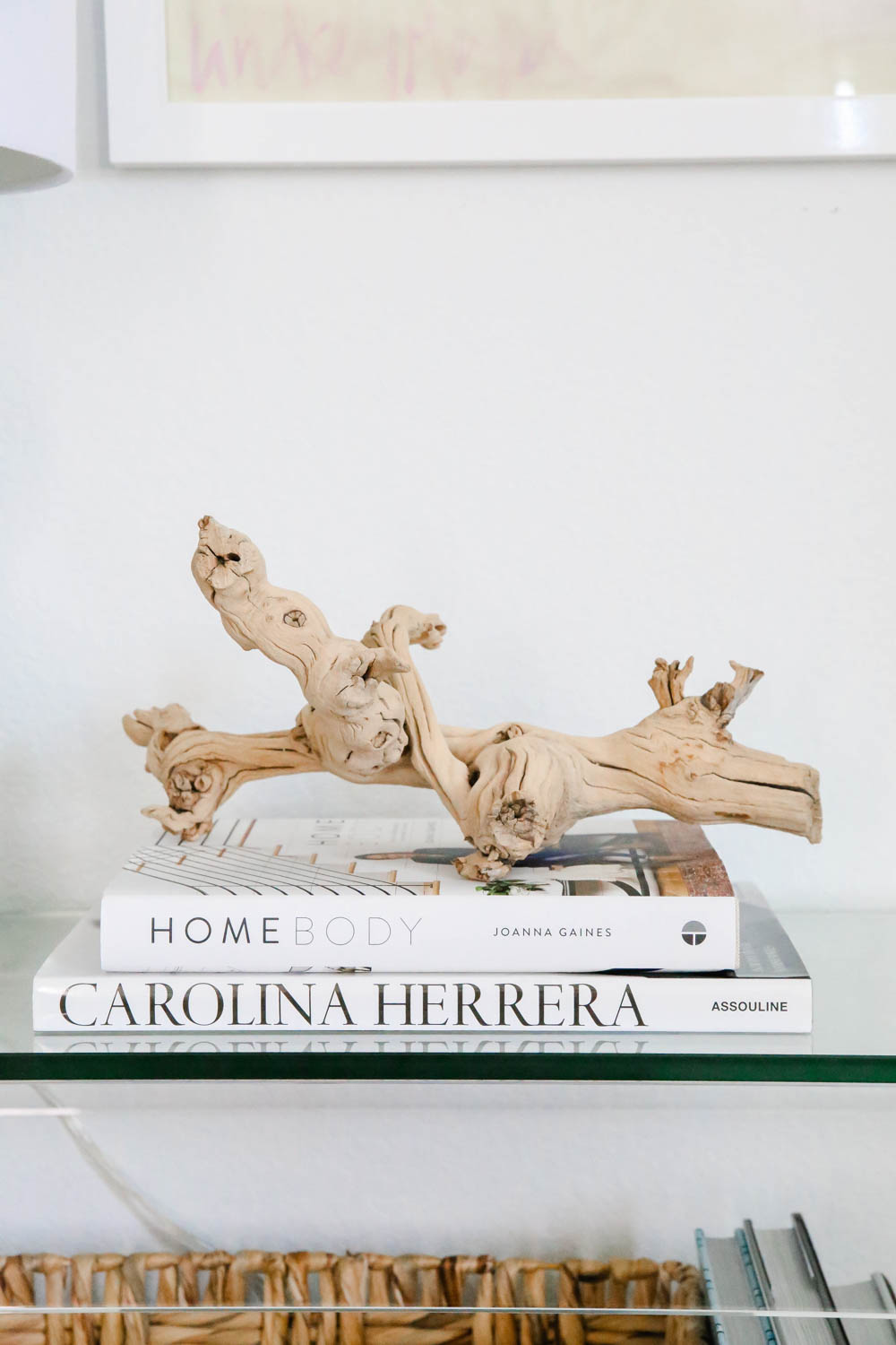 Coffee table books stacked on a entryway table. #entryway #summerdecor #ABlissfulNest