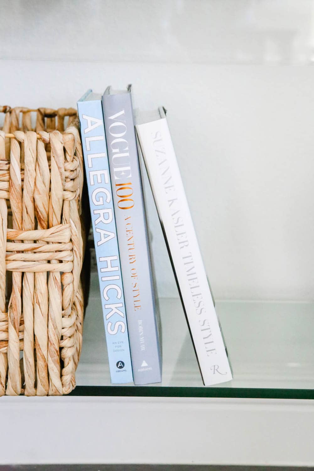 Coffee table books stacked on a entryway table. #entryway #summerdecor #ABlissfulNest