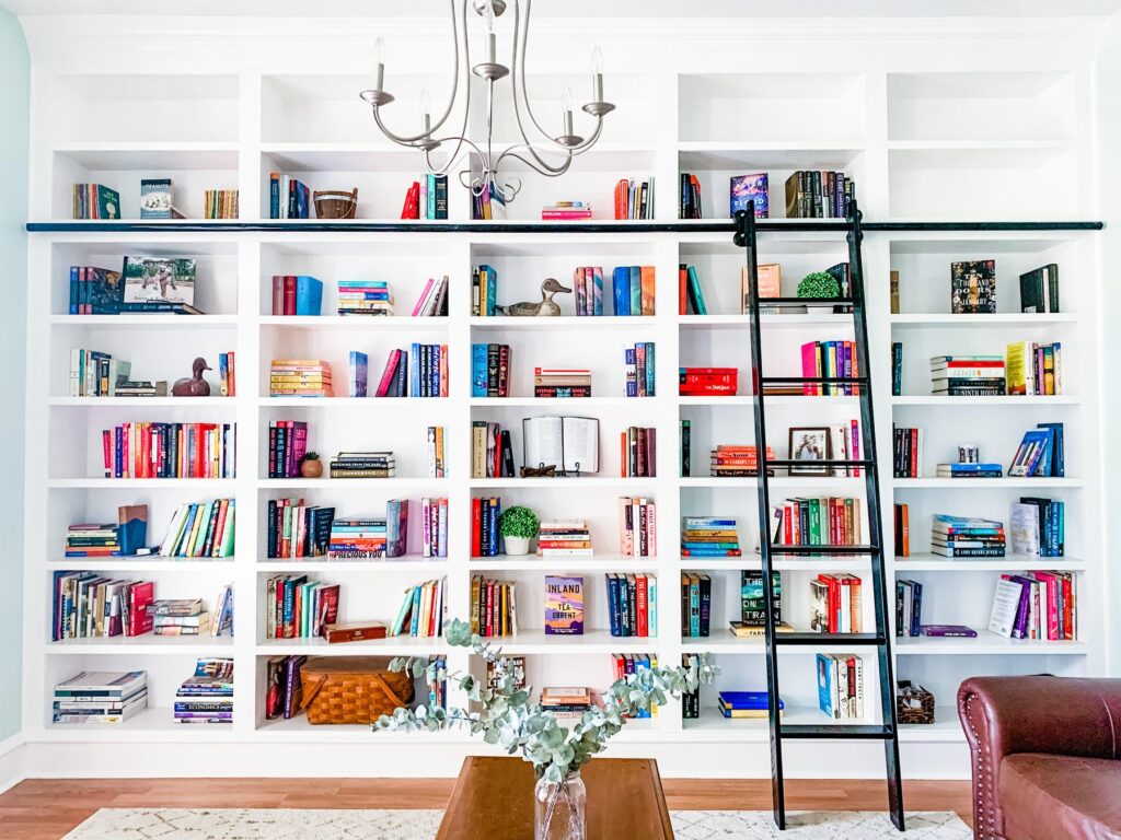 Chic wall of bookshelves filled with notebooks, books, and school supplies