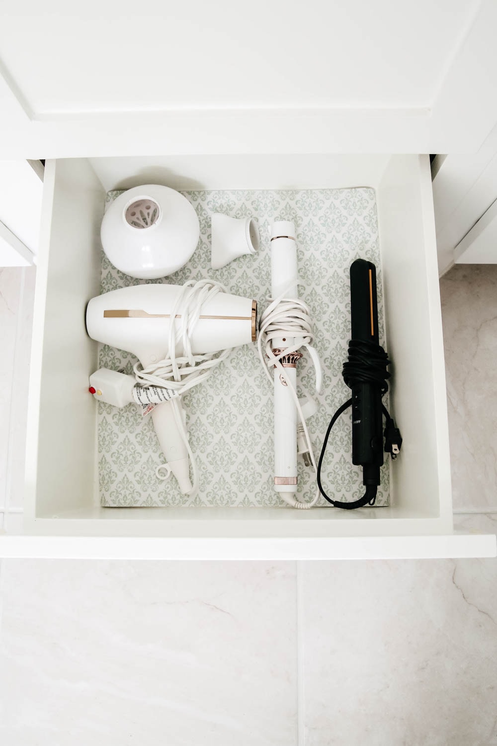 An easy hack to organize your bathroom cabinets and make them easy to clean + maintain to keep the clutter away. 