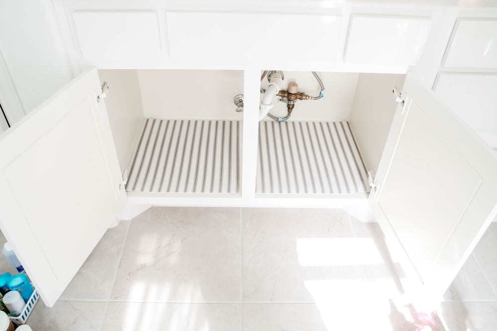 An easy hack to organize your bathroom cabinets and make them easy to clean + maintain to keep the clutter away.