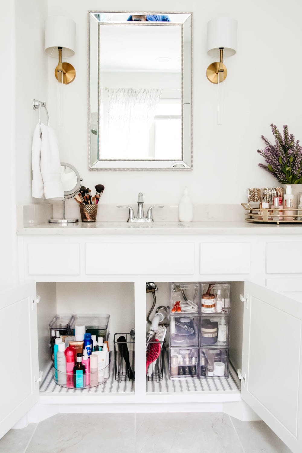 An easy hack to organize your bathroom cabinets and make them easy to clean + maintain to keep the clutter away.