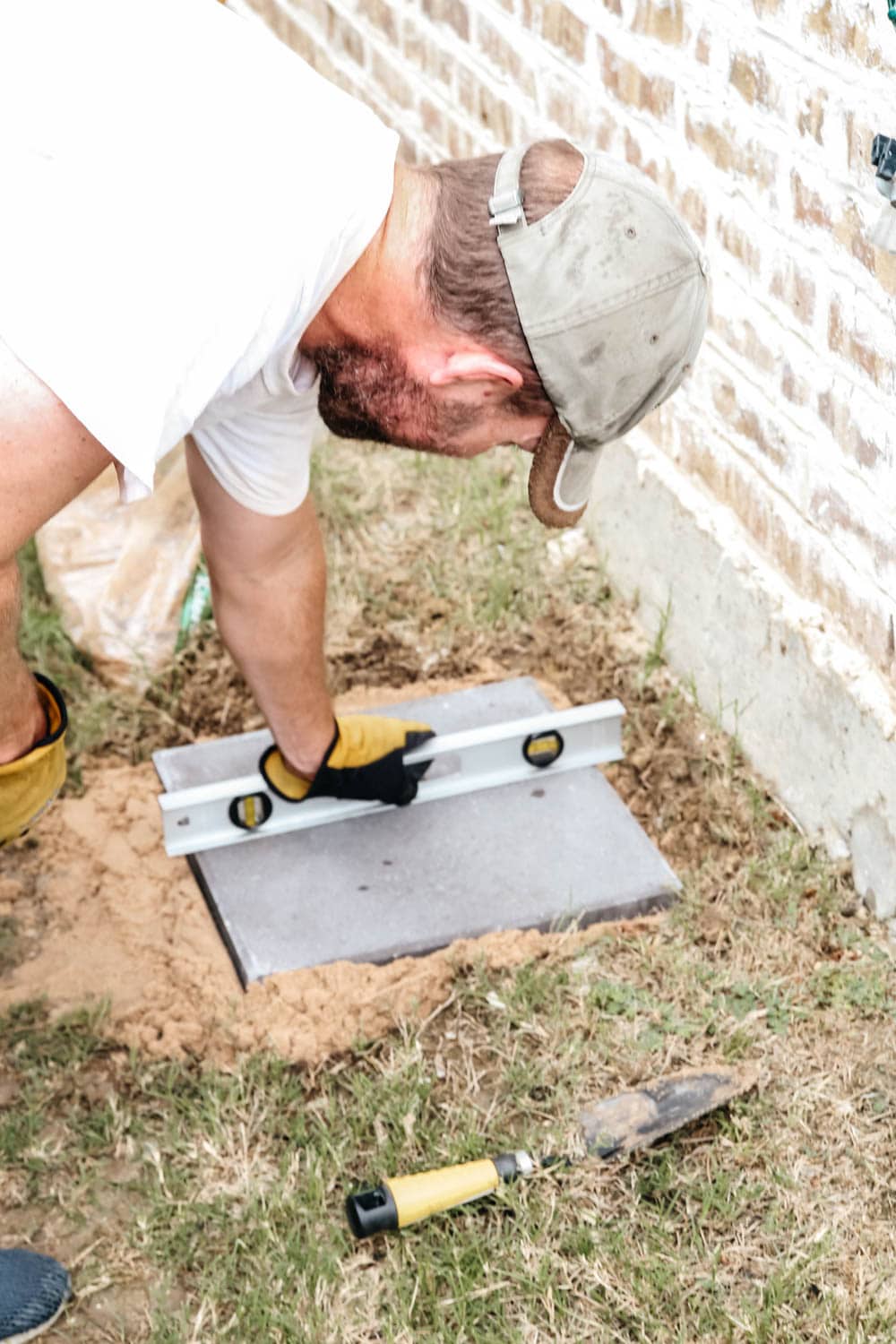 Install a rain barrel system for your home and save money and conserve your water supply. Simple step-by-step tutorial for installing a rain barrel. #ABlissfulNest